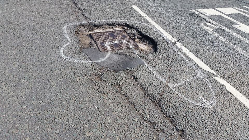 Illustration for article titled Hero Graffiti Artist Gets Potholes Fixed By Drawing Dicks On Them